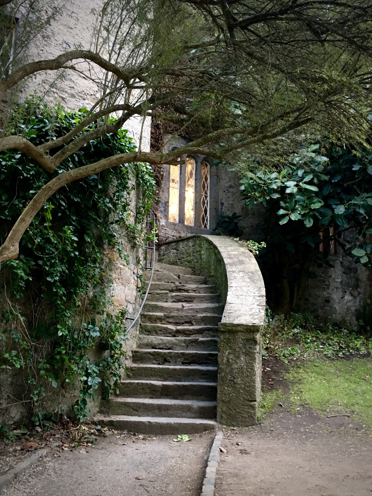 the small, pointed door in the far corner of the great hall