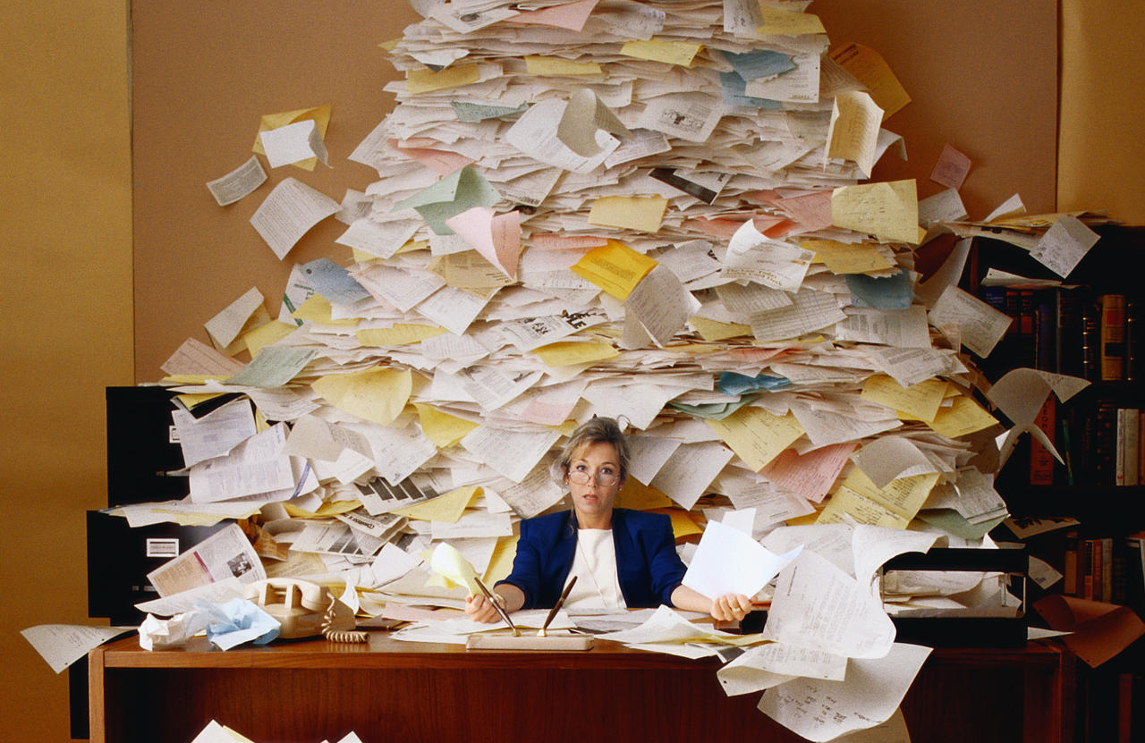 woman with a lot of paperwork