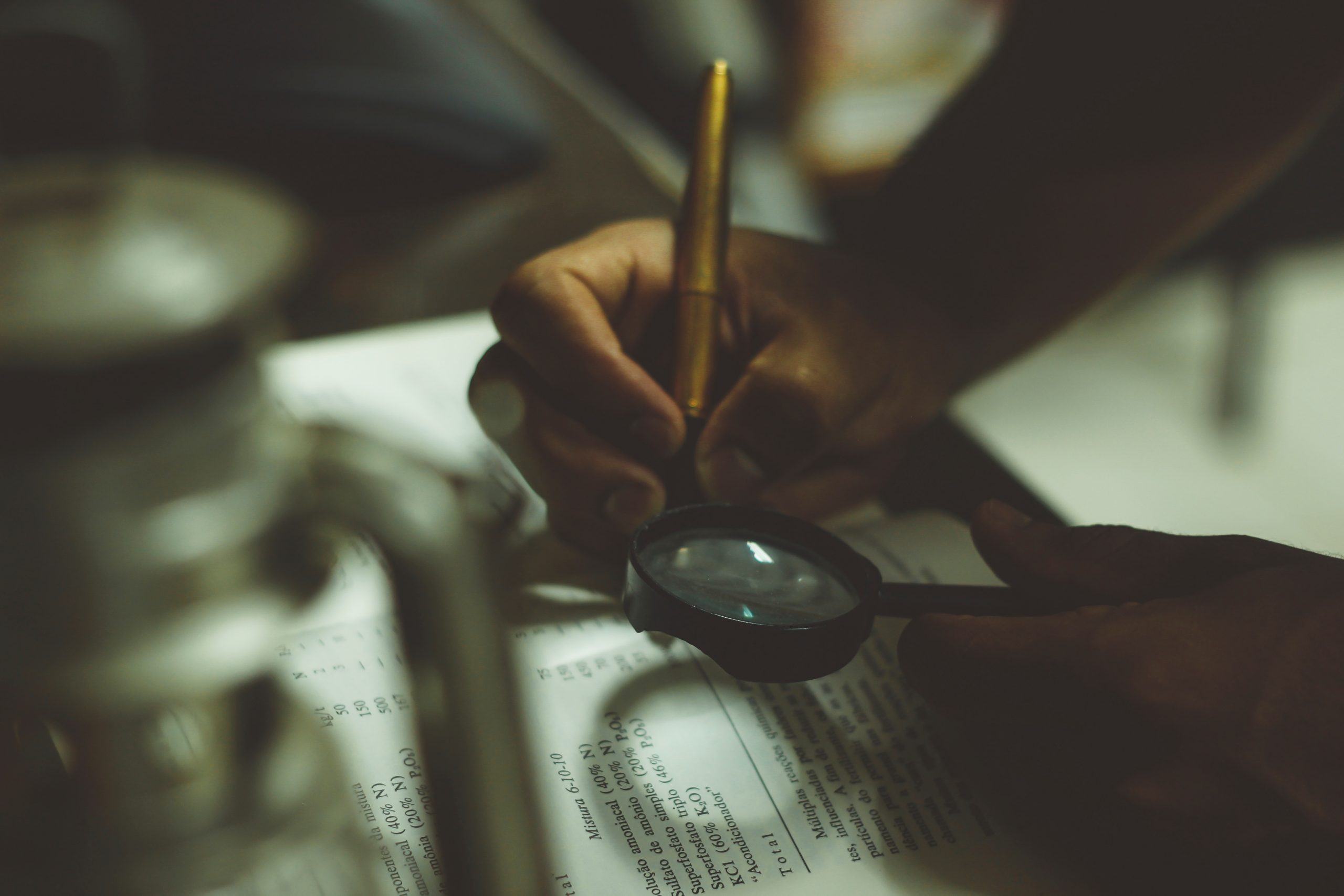 looking book with magnifying glass