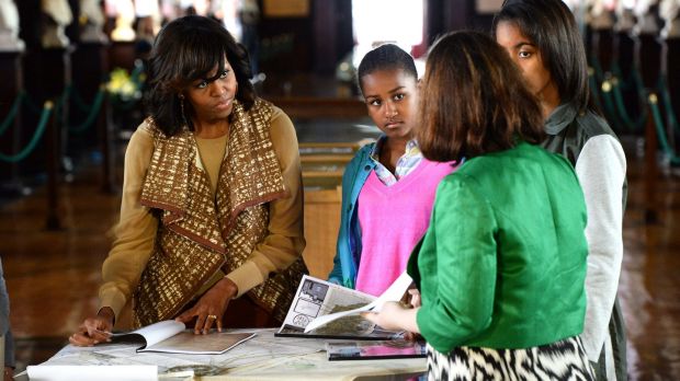 Michelle Obama with her daughters, Sasha and Malia, listening to Fiona Fitzsimons as she told them about the Obamaâs Irish ancestry in 2013. Photograph: Cyril Byrne / The Irish Times