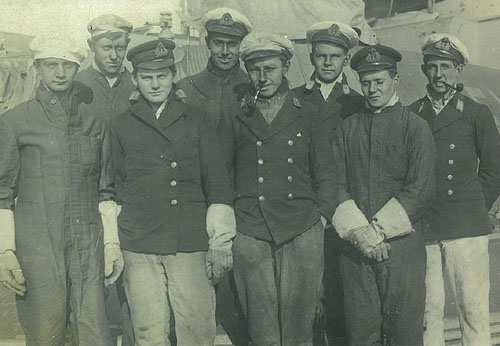 Rickard Donovan pictured on the far right smoking his pipe, with his colleagues on a submarine